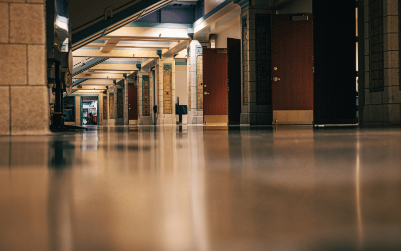 tan epoxy floor in commercial building hallway